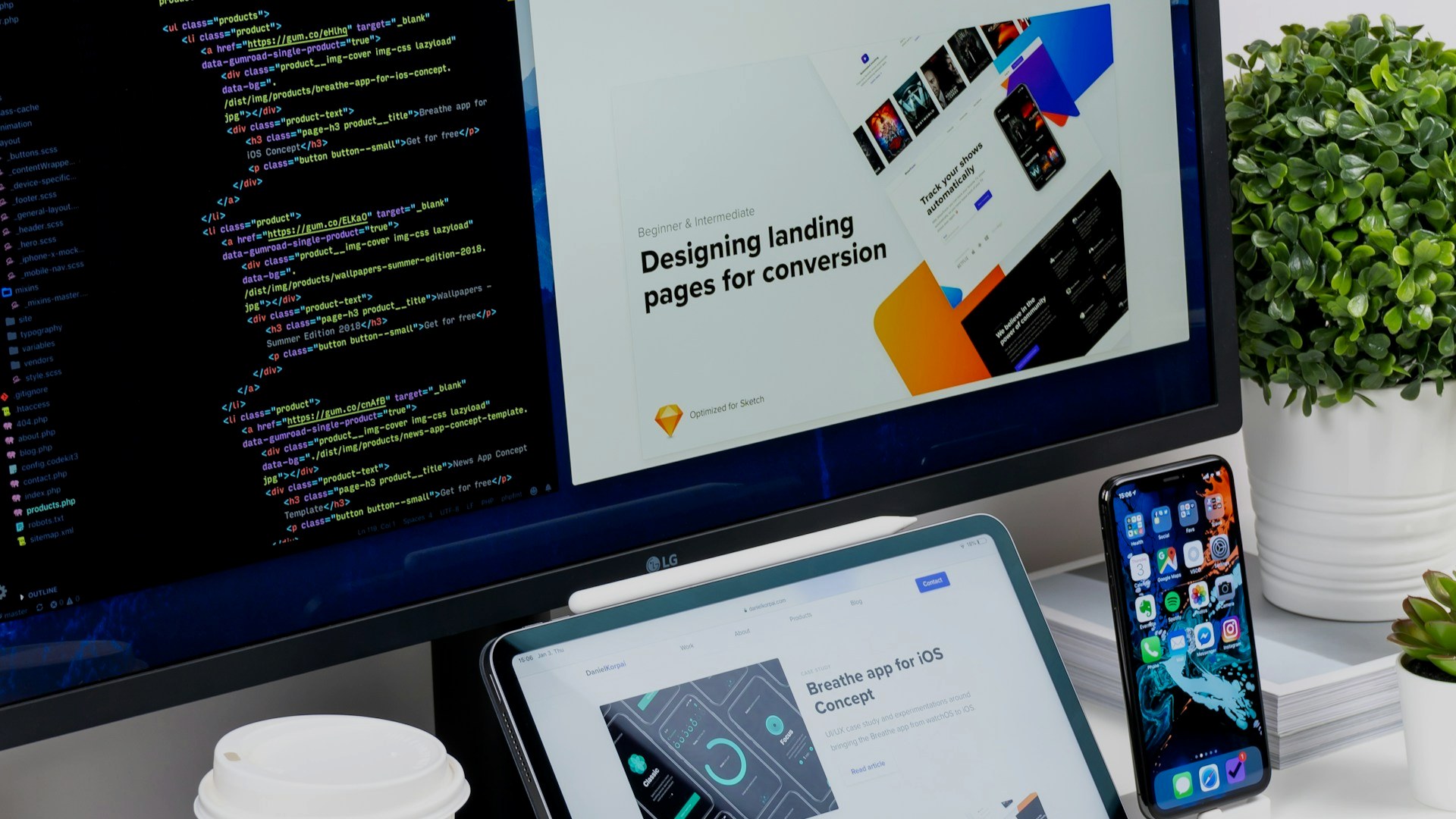 Web and software design workspace with laptop, tablet, and mobile screens